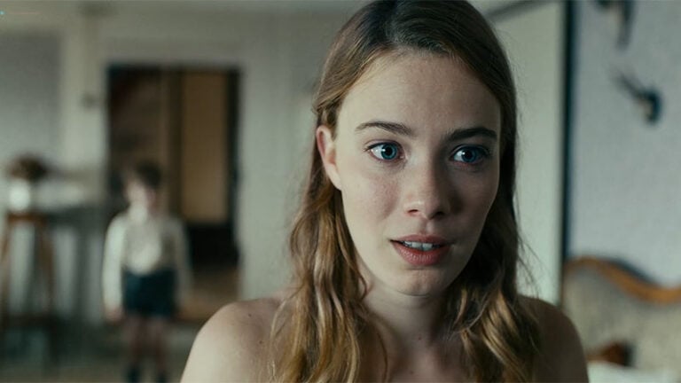 Beautiful brunette with big blue eyes plays the piano naked for innocent kid