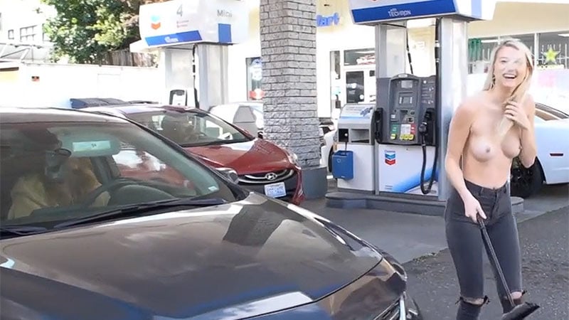 Topless, gorgeous blonde washes car at a crowded gas station